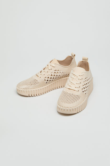 A pair of Tulip Embroidered Platform Lace Up Trainers in beige, featuring perforations and textured soles, is displayed on a plain white background.