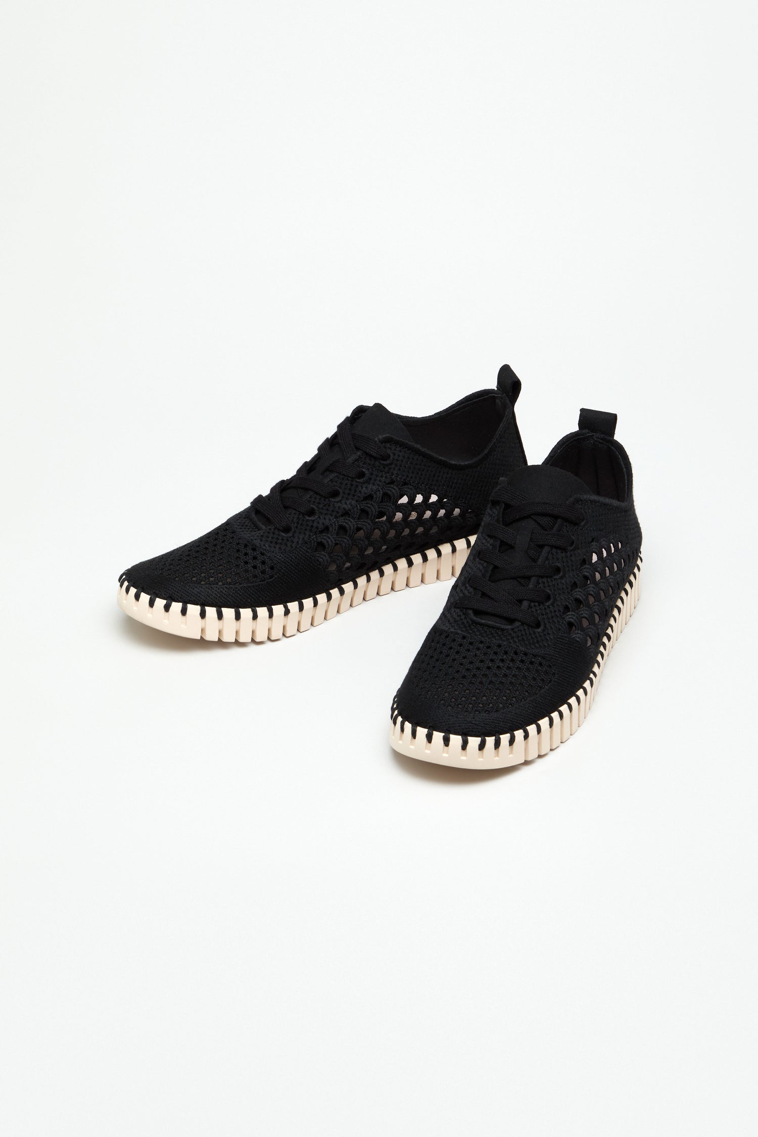 The Tulip Embroidered Lace Up Trainers are black lightweight sneakers with white textured soles and a lace-up design, shown on a plain white background.