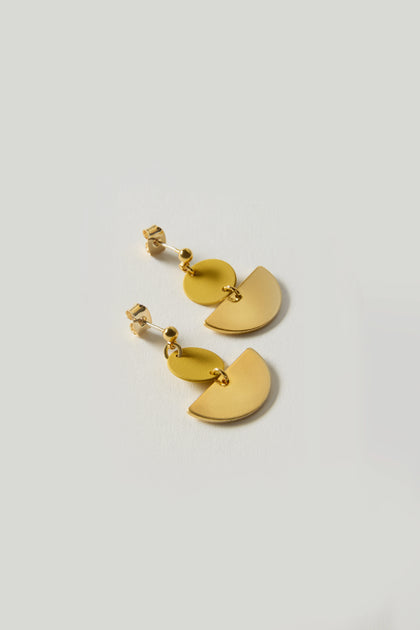 Colour Pop Semi Circle Earrings feature a gold-tone geometric design with circular and semicircular shapes on a light background, ideal for minimalist earring enthusiasts.