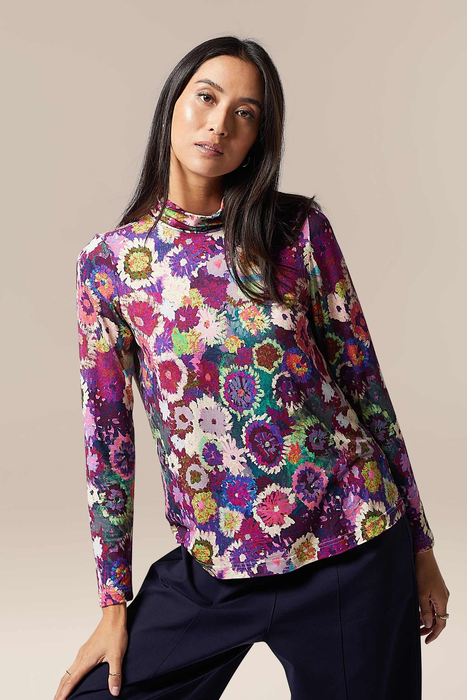 The model is wearing a Midnight Garden Jersey Polo Neck.