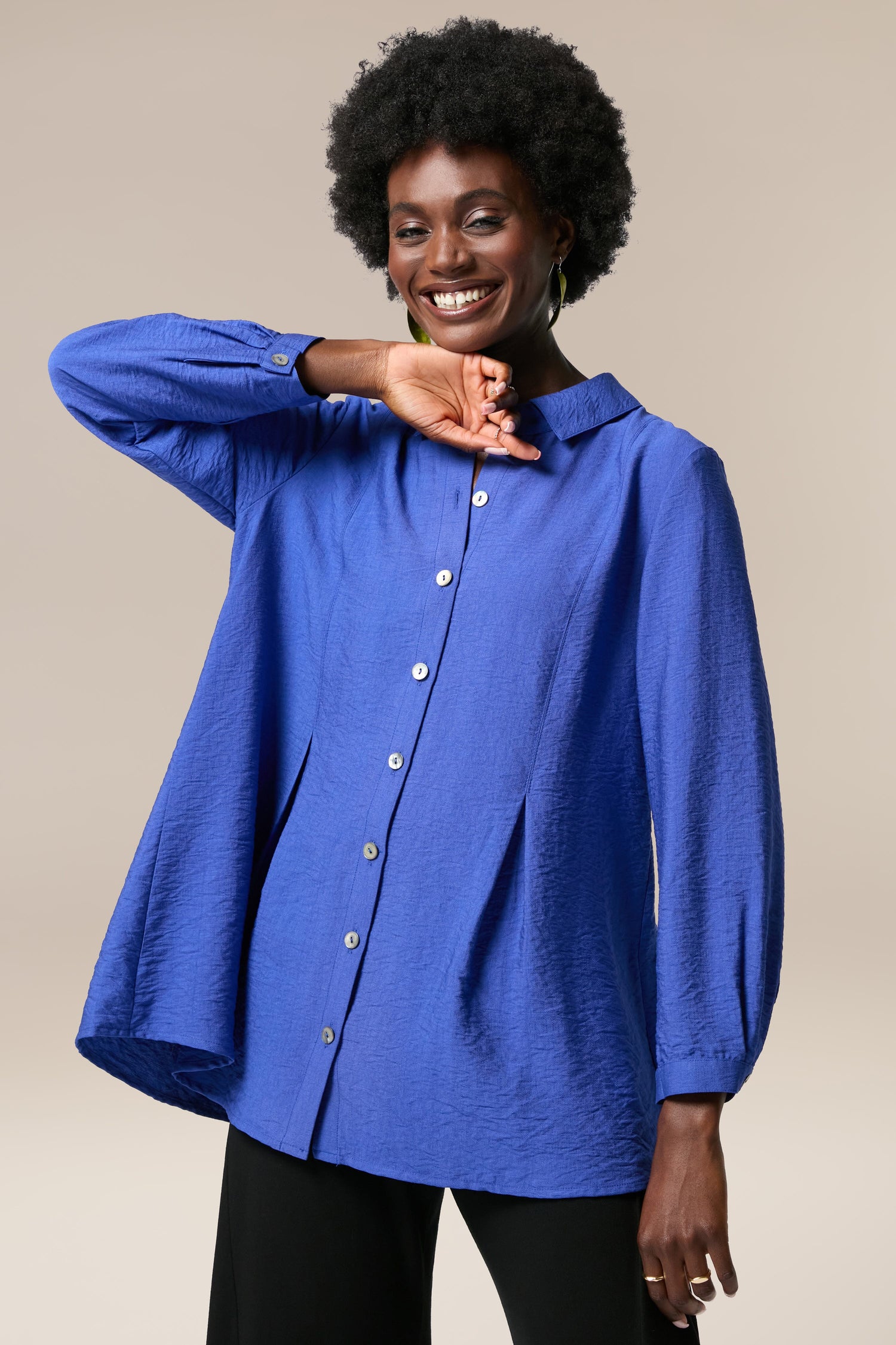 A black woman wearing a Textured Viscose Pleat Shirt.