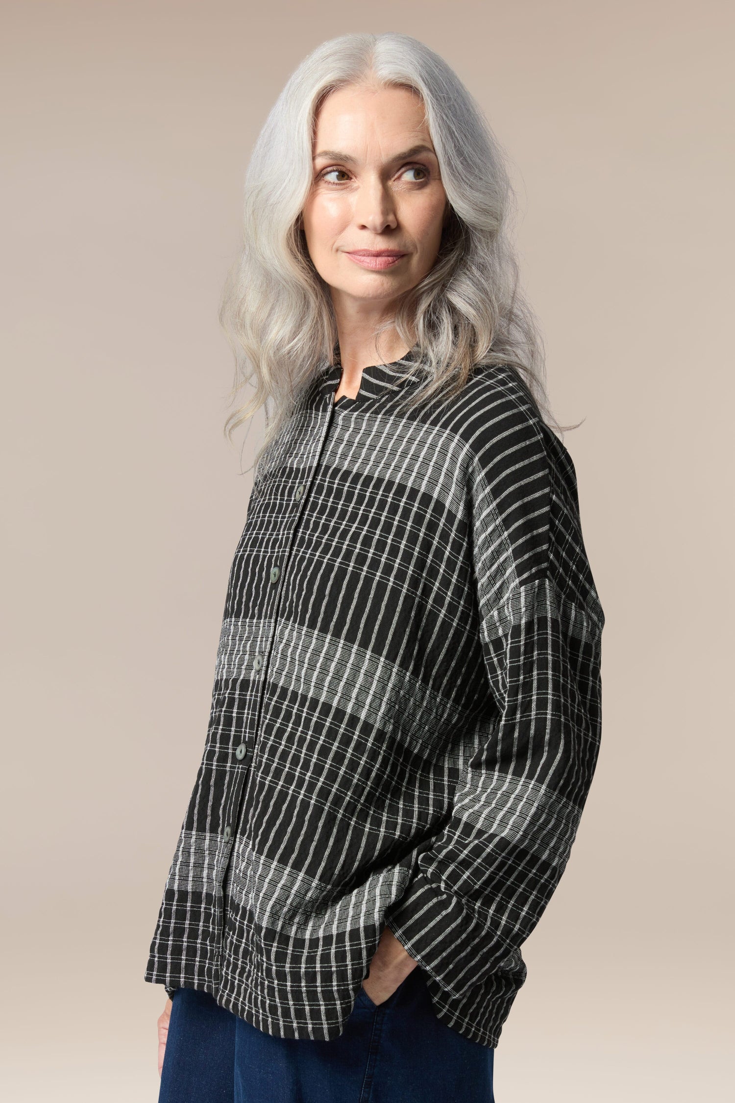 A woman wearing a comfortable Gradient Check Shirt.