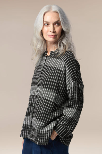 A woman wearing a comfortable Gradient Check Shirt.