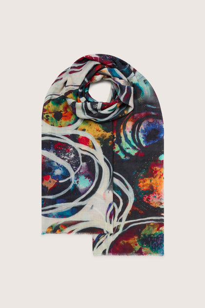 A luxurious Planetary Wool Scarf with a colorful pattern, perfect for all-occasion styling.