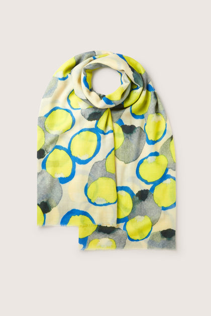 A Neon Spot Wool Scarf with circles on it, perfect for all-occasion styling.