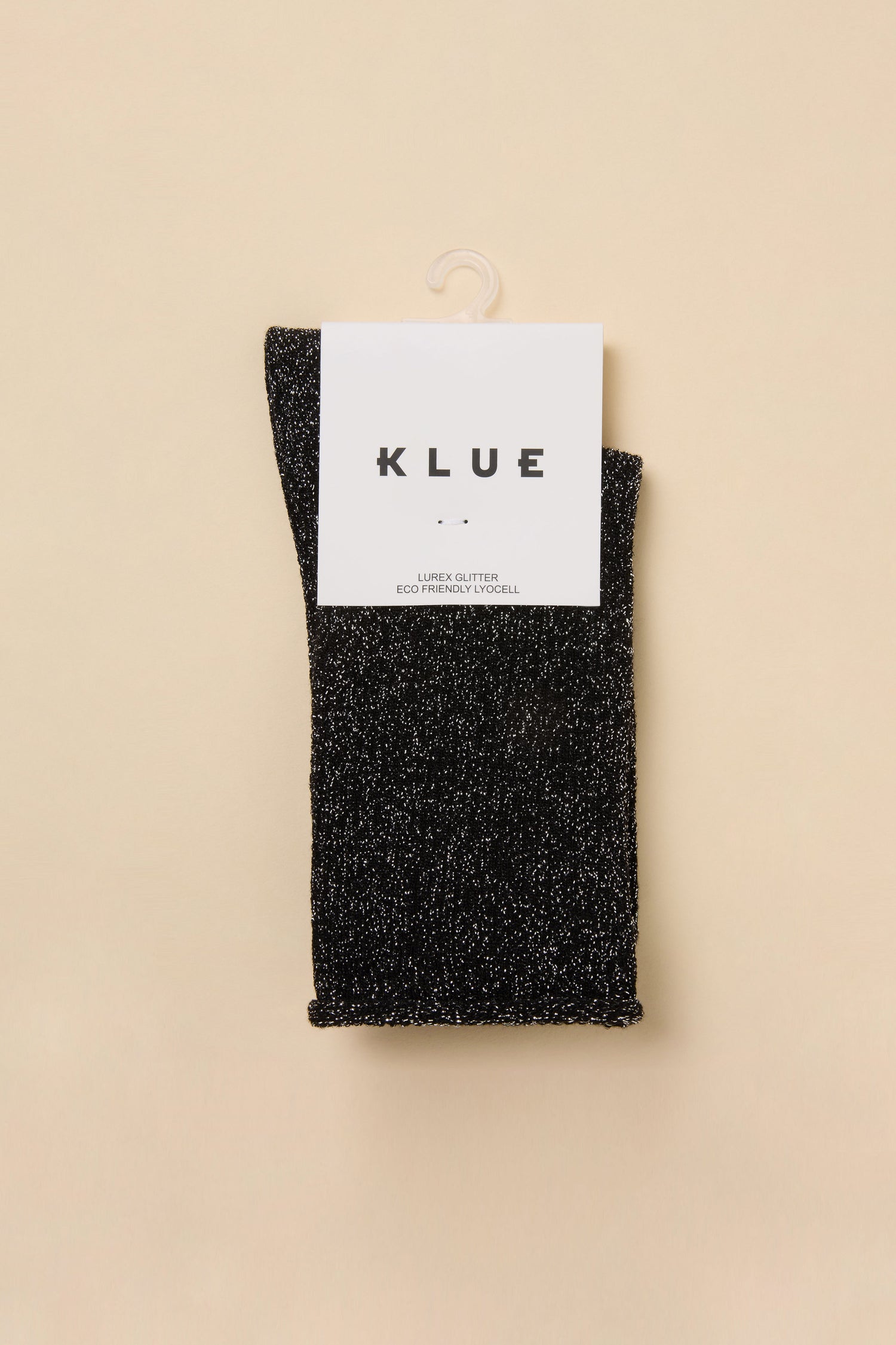 Black Bamboo Sparkle Socks in a black sparkly lyocell-blend knit with a product tag that reads “KLUE, LUREX GLITTER, ECO FRIENDLY LYOCELL.”