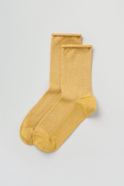 The Bamboo Sparkle Dijon Socks, featuring a yellow hue with a subtle shimmer, are displayed flat on a simple white background.