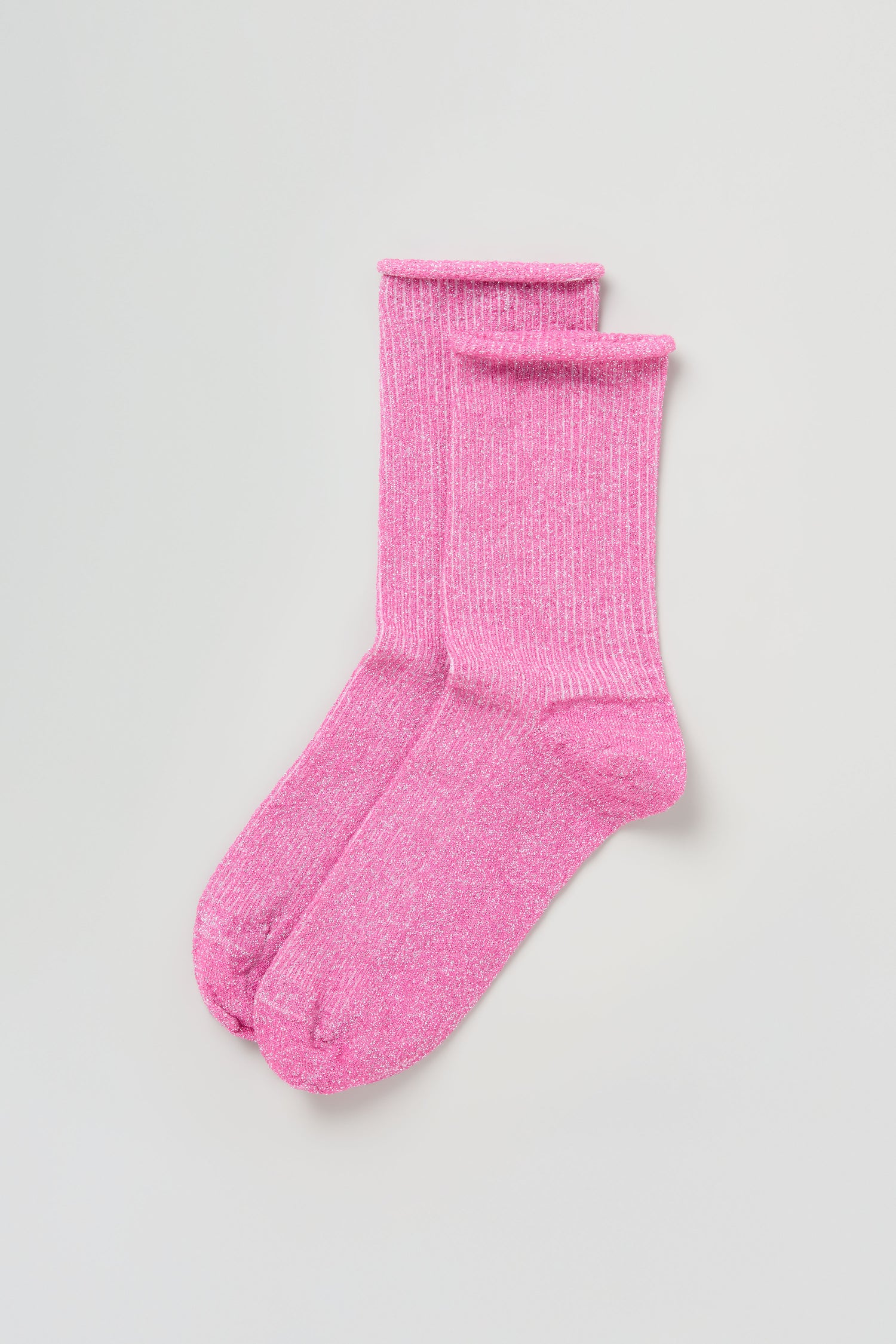 A pair of Bamboo Sparkle Fuchsia Socks is laid flat on a plain light background.