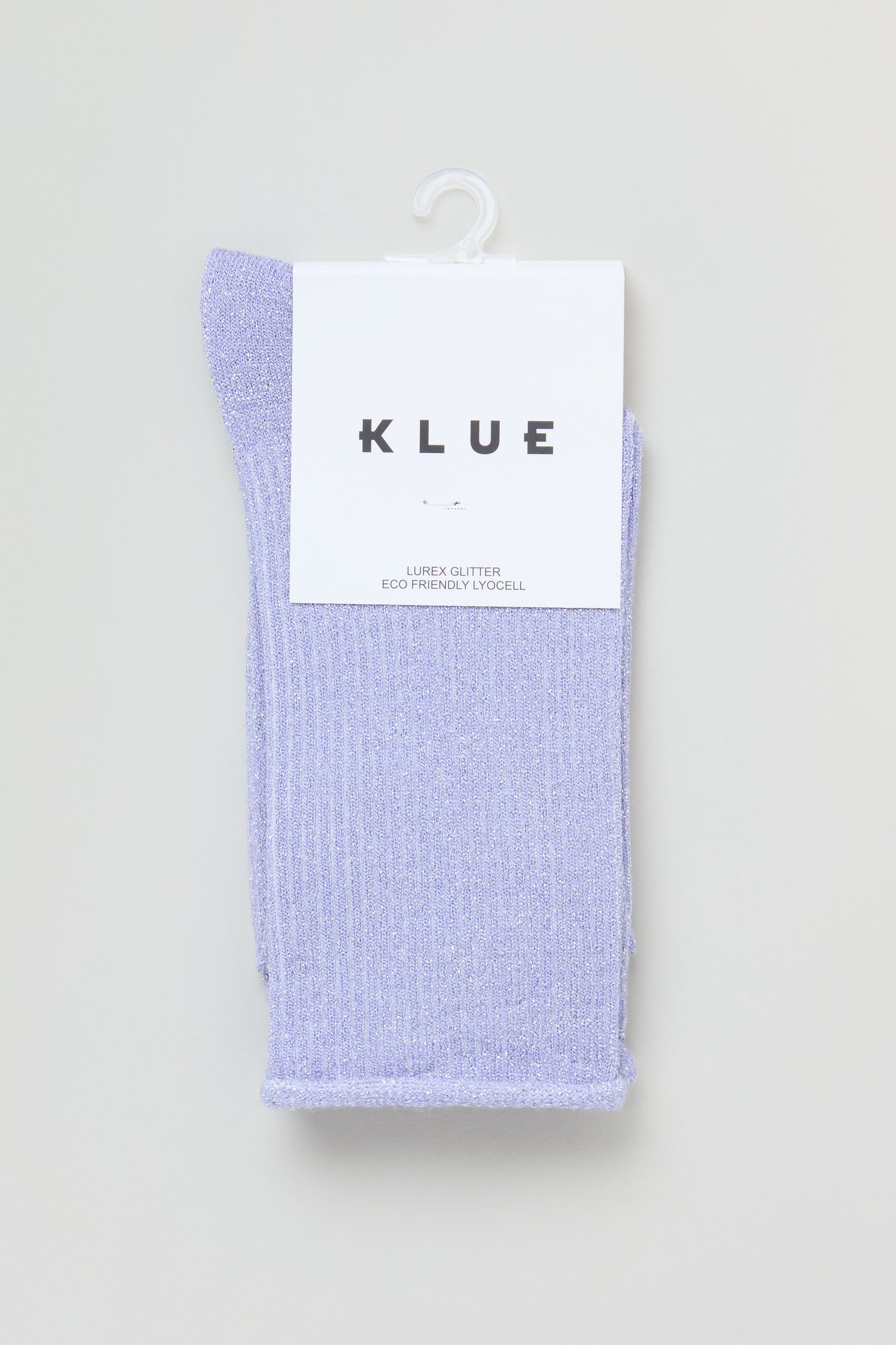A pair of Bamboo Sparkle Lilac Socks with ribbed glitter and metallic lurex, folded and packaged under a white label displaying the brand "KLUE.