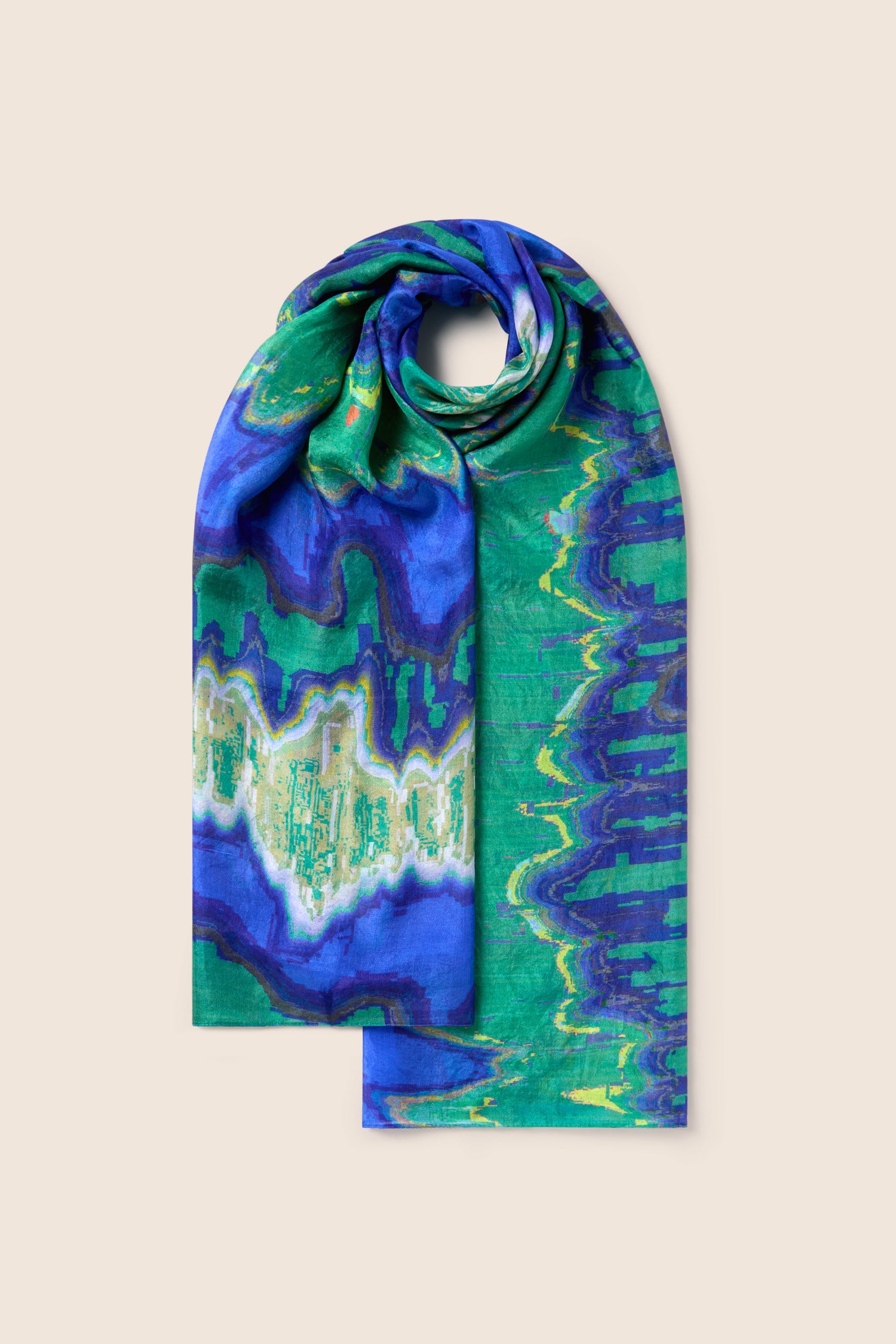 Introducing the Mineral Silk Scarf, a stunning accessory adorned with vibrant hues of blue, green, and white in an abstract wave pattern. Expertly crafted to exude refined luxury in every thread.