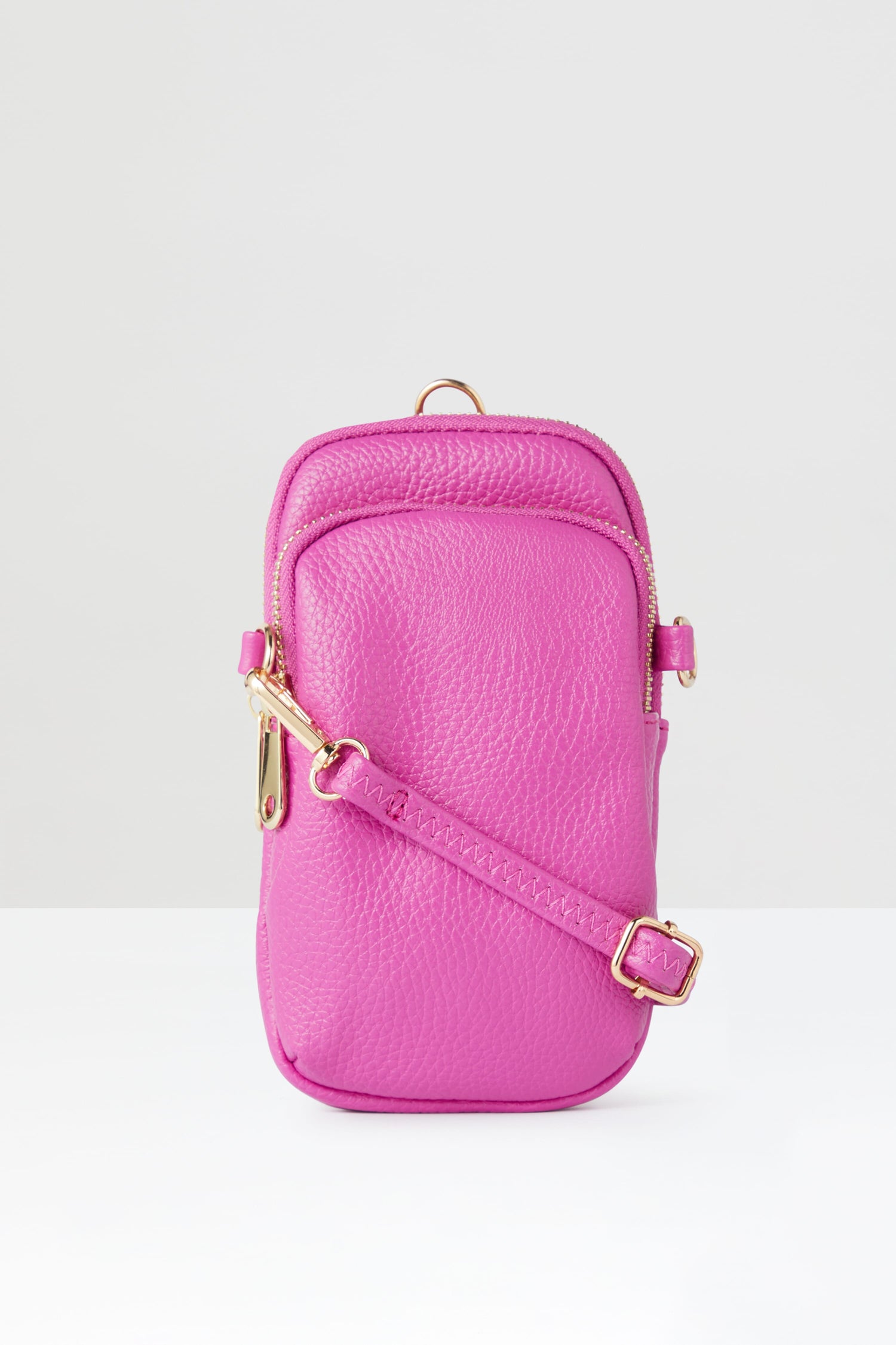 A pink Mini Crossbody Bag with a gold strap.