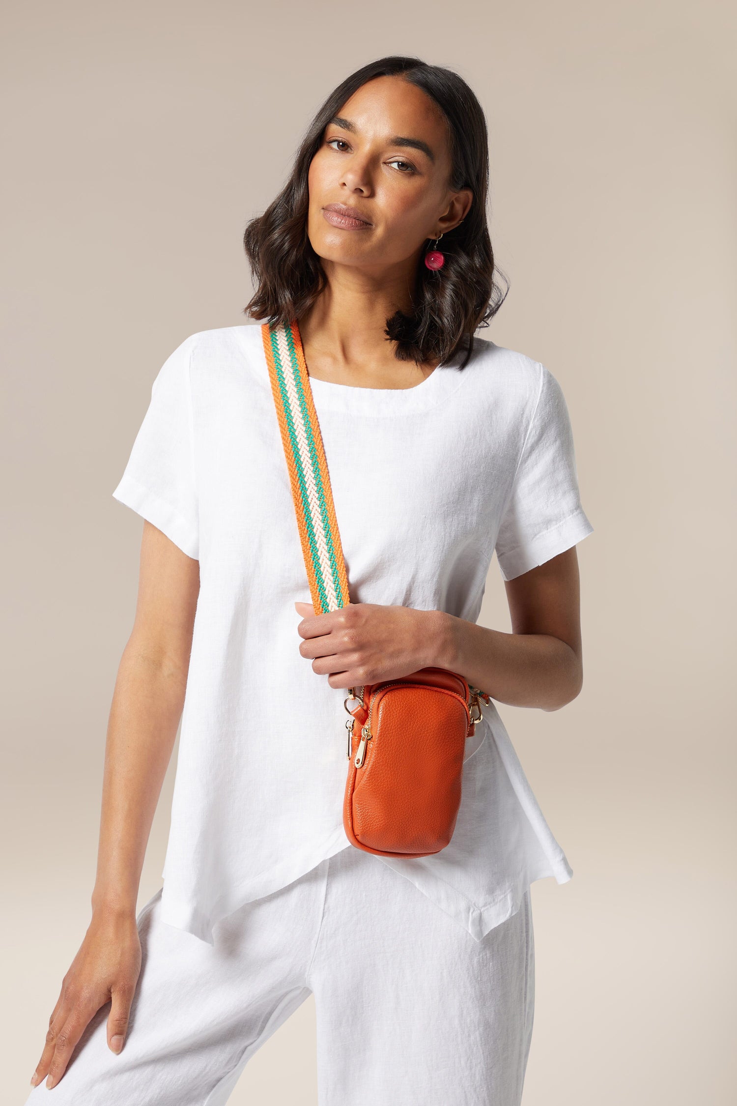 A woman sporting a Mini Crossbody Bag.