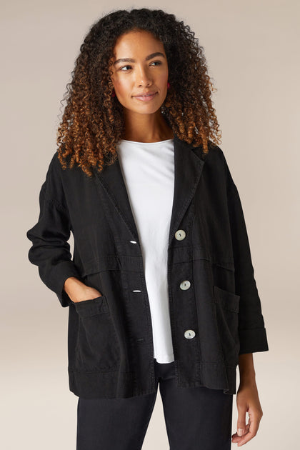 A woman wearing a Twisted Linen Boxy Jacket.