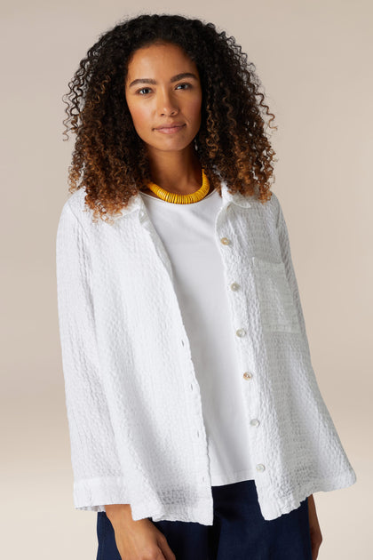 A woman wearing the Waffle Linen Pocket Shirt.