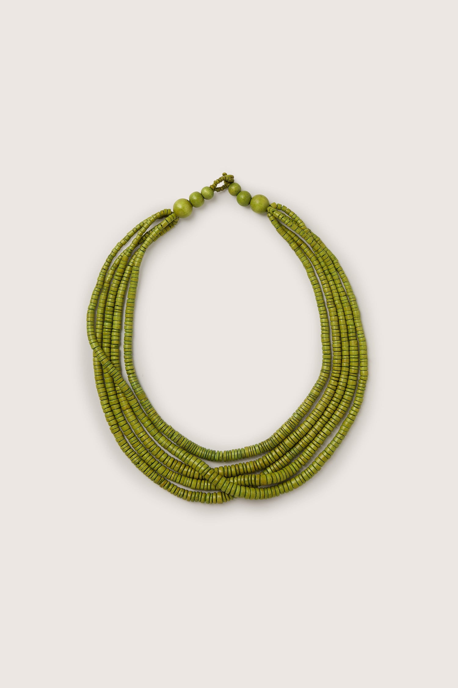 A Coconut Shell Disc Necklace with green coconut shell beads on a white background.