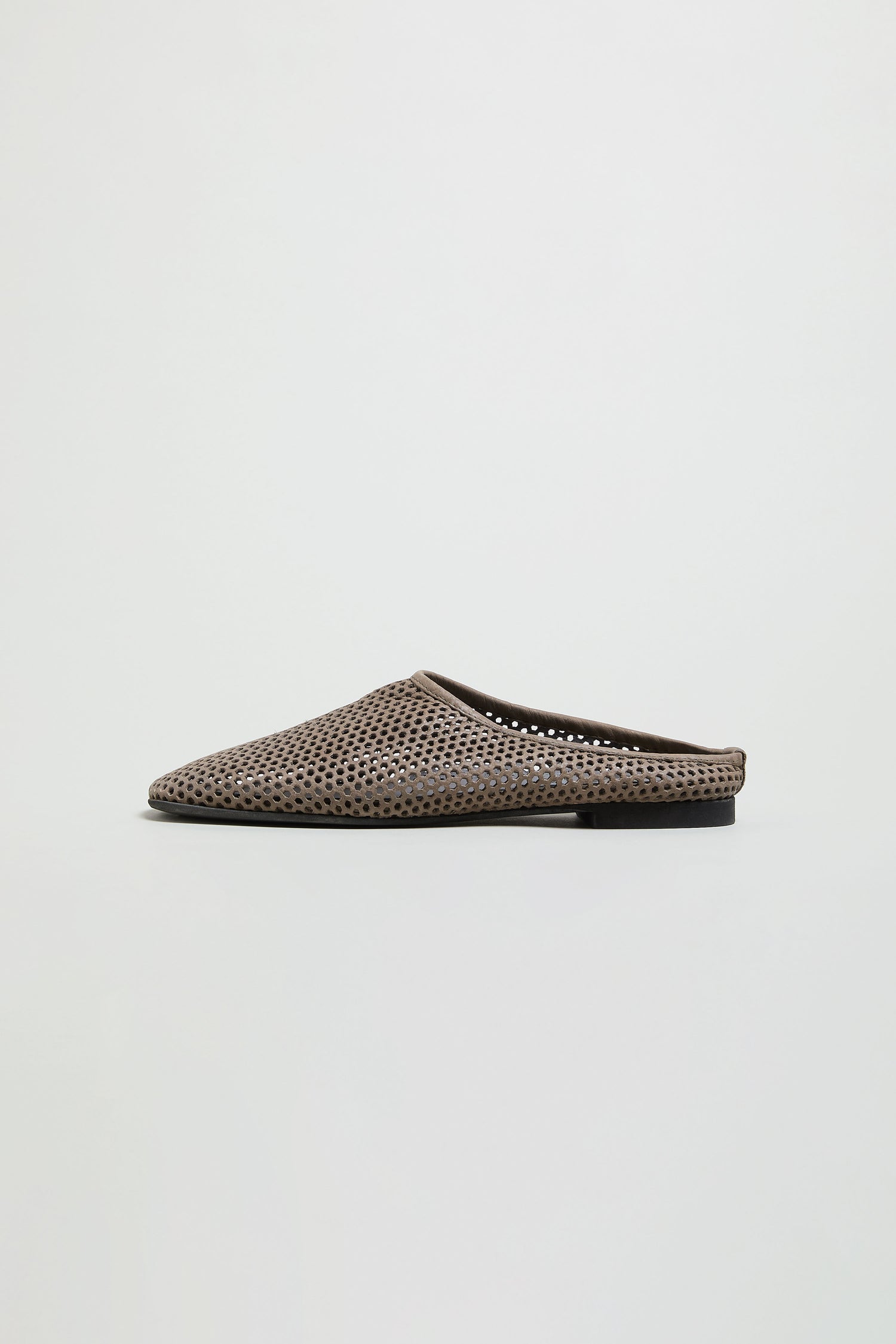 Mesh Leather Slip on Shoes featuring a brown perforated mesh leather upper and flat black sole, handmade in Europe and shown against a white background.