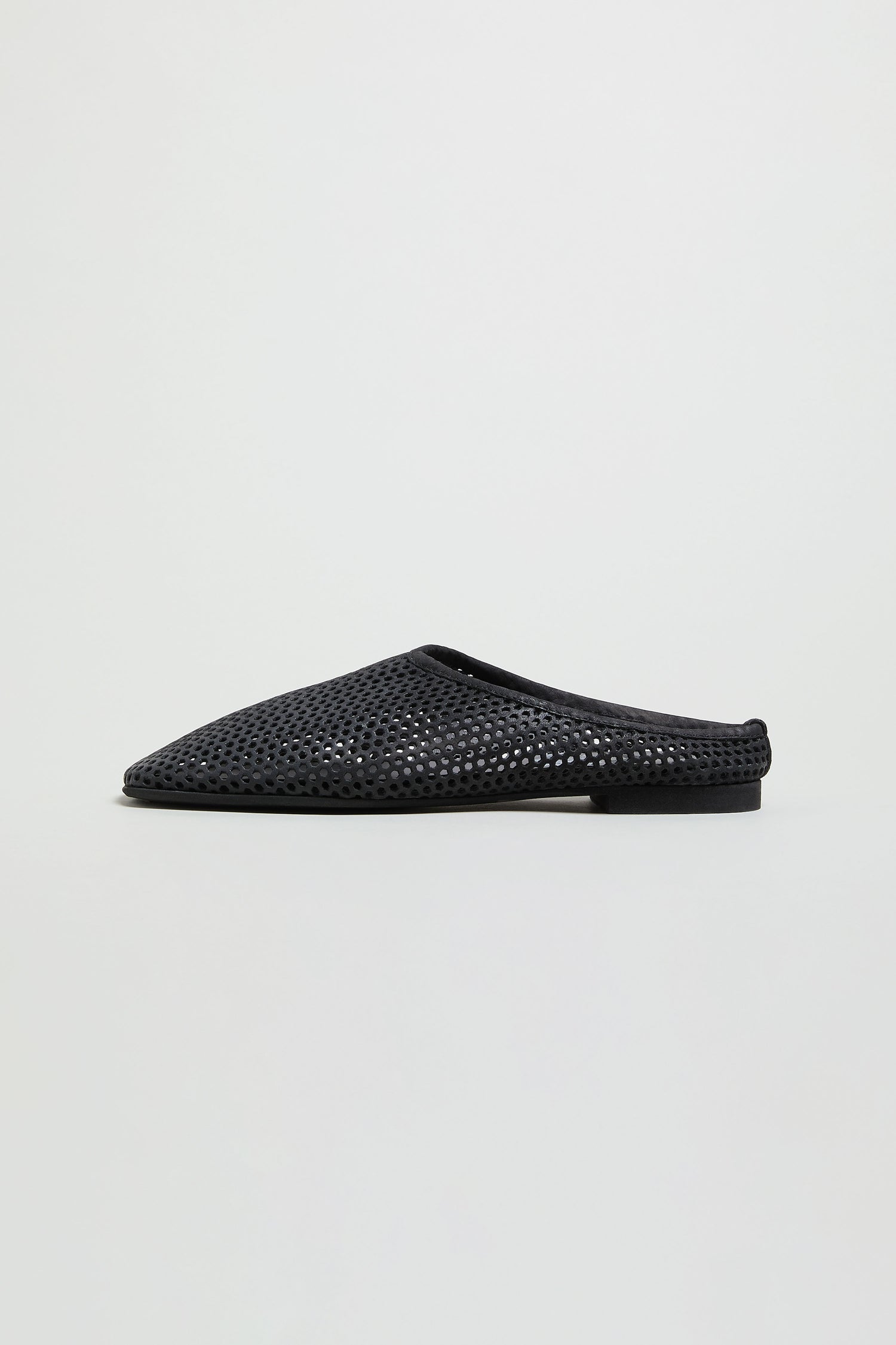 The Mesh Leather Slip on Shoes, handmade in Europe with black mesh leather and a flat sole, are shown against a plain white background.