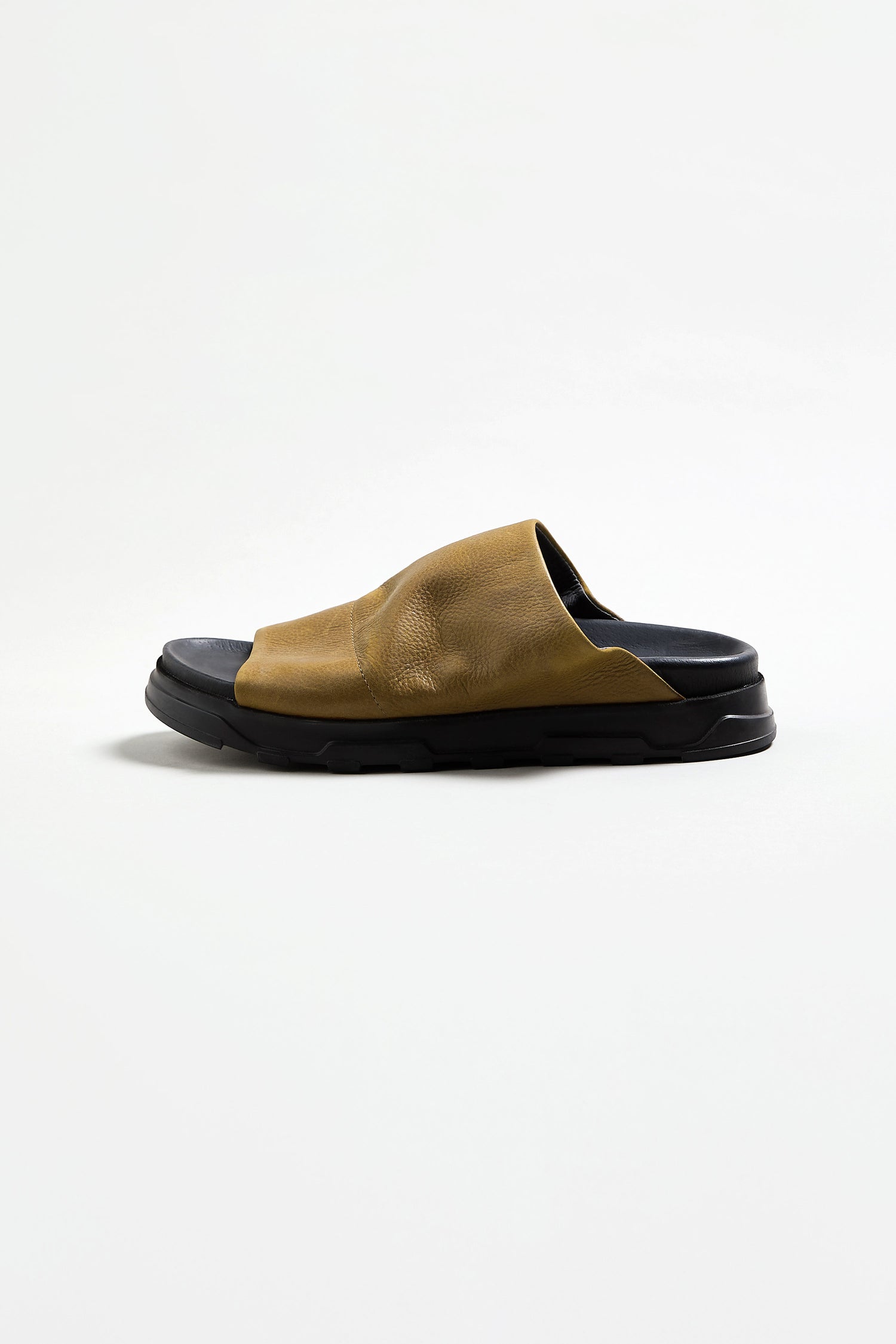 A single Crushed Leather Slider, featuring a wide brown leather upper and thick black rubber sole, made in Italy by Lofina, is displayed on a plain white background.