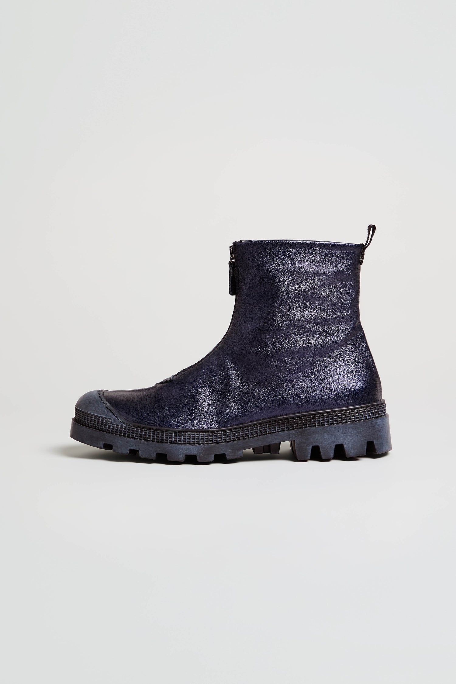 A pair of Metallic Blue Violet Zip Front Leather Boots featuring a chunky tread sole and pull tab, displayed on a plain light background.