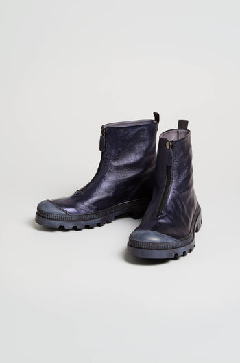 A pair of Metallic Blue Violet Zip Front Leather Boots with chunky tread soles is displayed on a plain light background.
