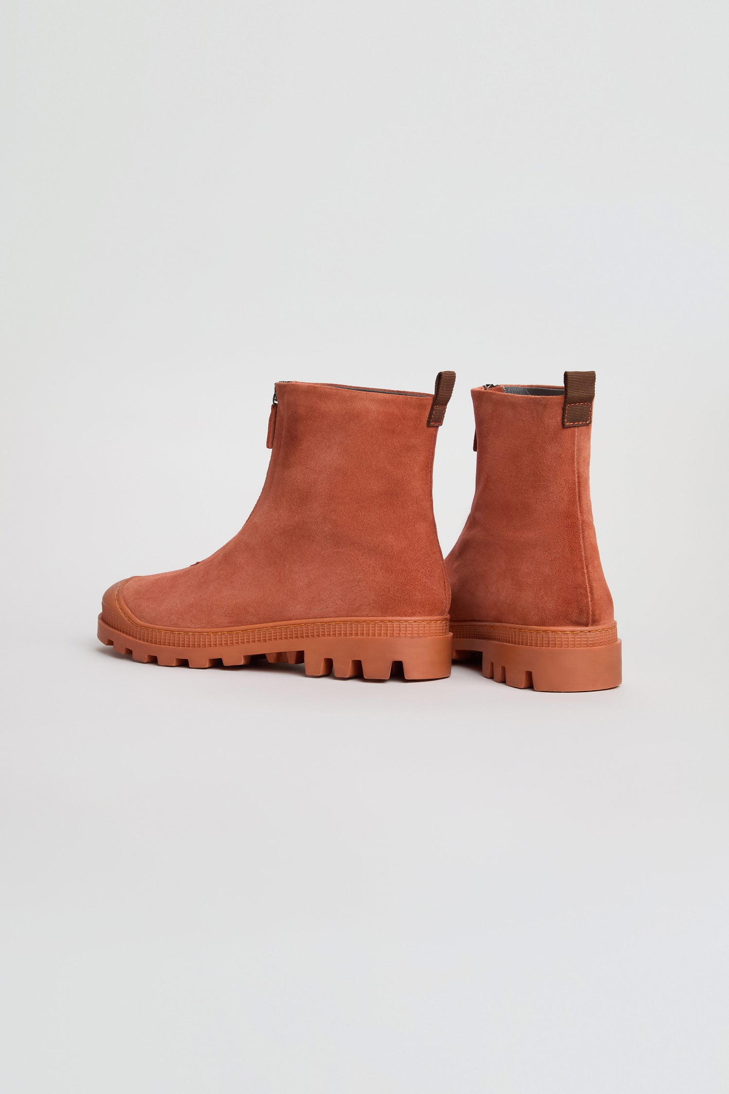 A pair of rust-colored Zip Front Suede Boots by Lofina, handmade in Italy with side zippers and chunky rubber soles, displayed on a plain light background.