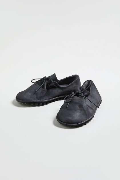 A pair of Crushed Leather Lace up Shoes, handmade in Italy in black leather, displayed against a plain white background.