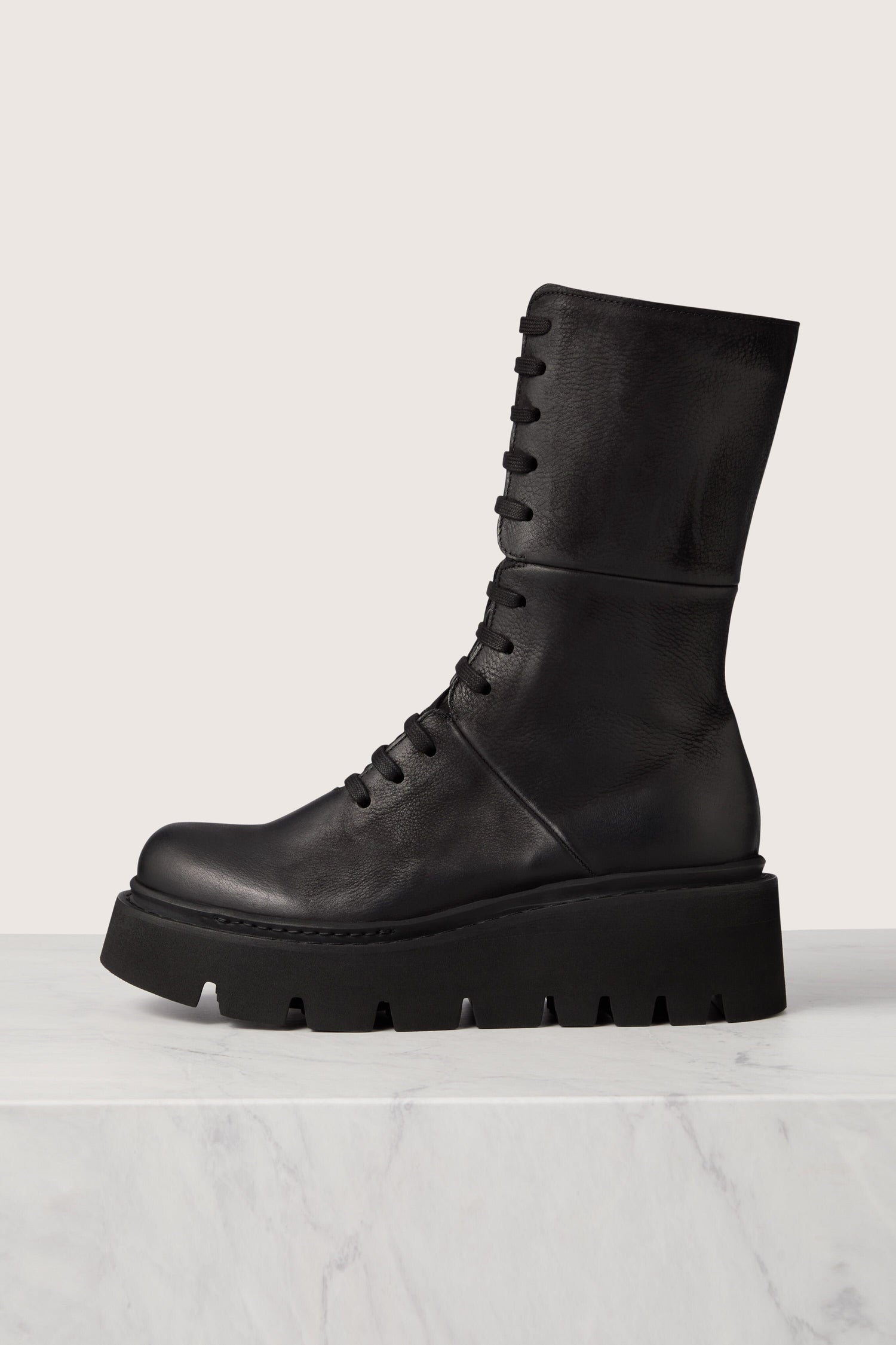 Italian craftsmanship meets Danish design in these Platform Lace Up Leather Boots.