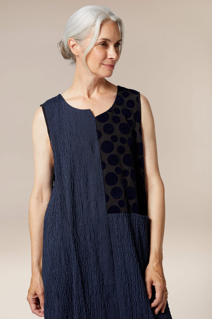 A woman wearing a Stripe Patch dress.