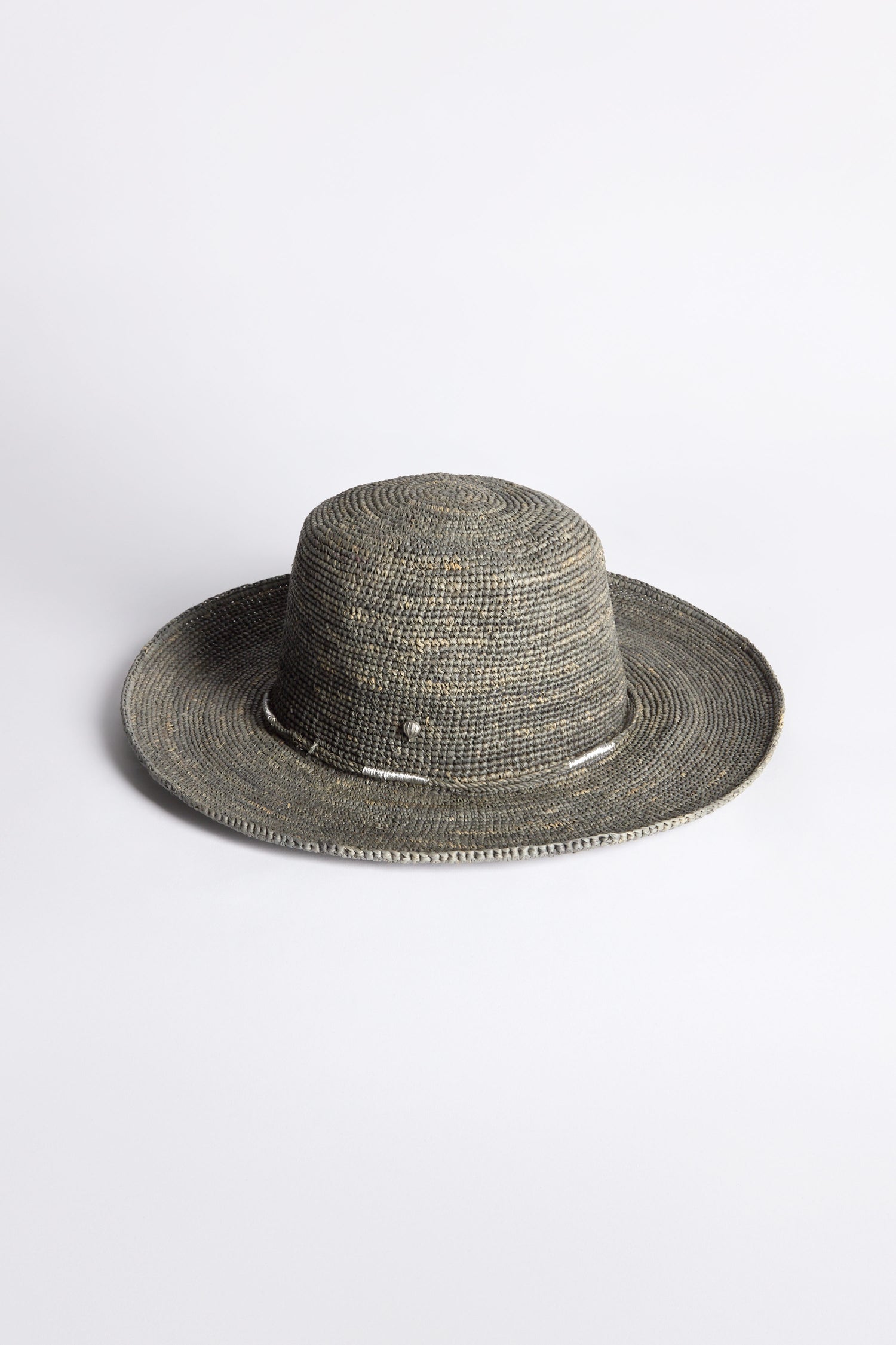 The Chapeau Westilux, a raffia-crafted hat featuring a wide brim and textured weave, rests elegantly on a plain white background—ideal for elevating your summer wardrobe.