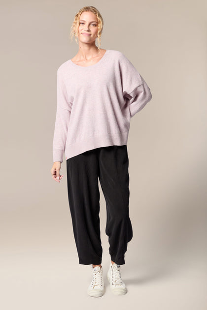 The model is wearing a Granit Scoop Knit sweater.