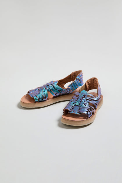 The Frida Mermaid Leather Sandals are handcrafted in Mexico with woven blue and purple leather, tan soles, and open toes, shown against a light background.