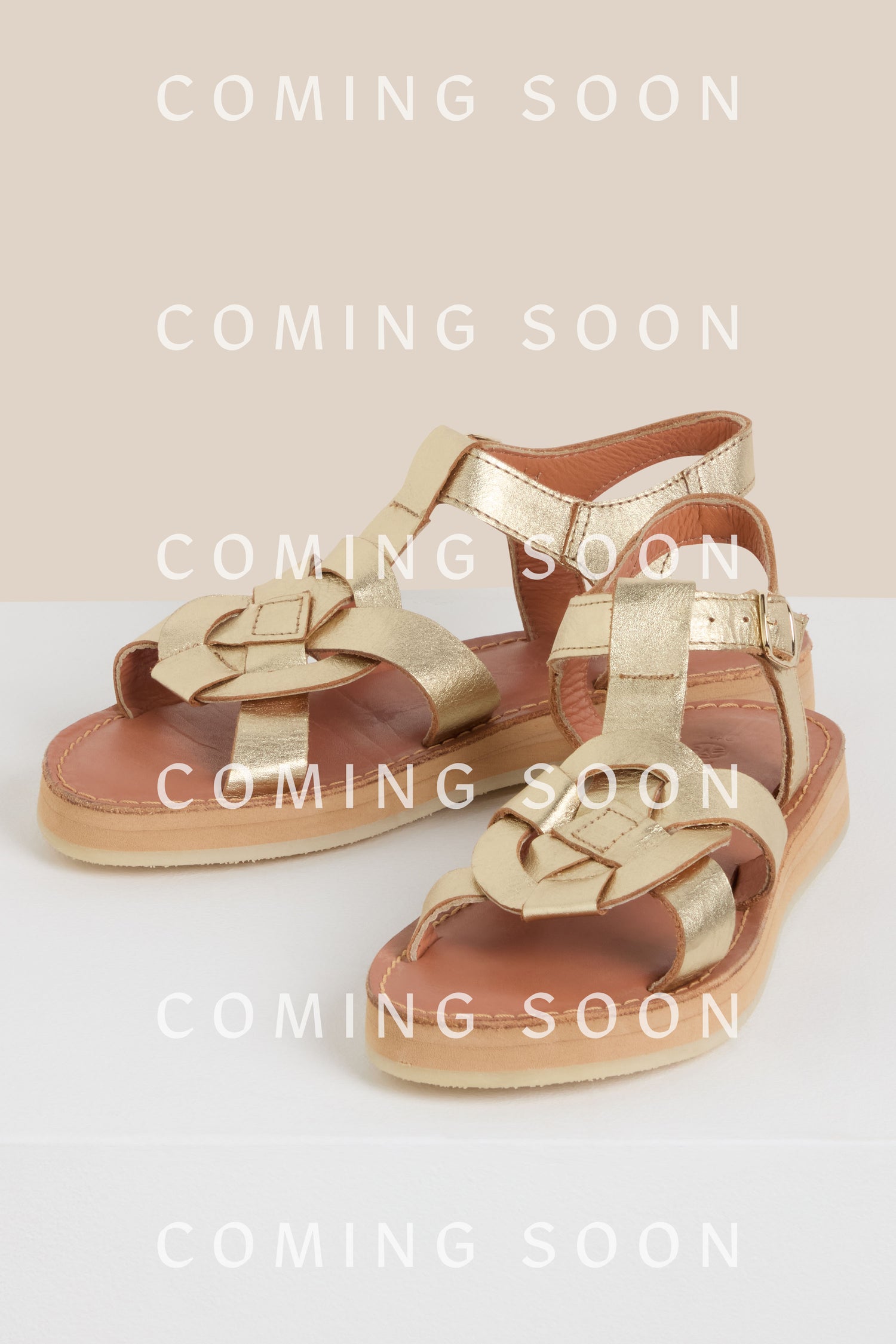 Tulum Leather Buckle Sandals in gold are showcased with "COMING SOON" text elegantly overlaid multiple times, hinting at elegance and anticipation from the MAPTULUM collection.