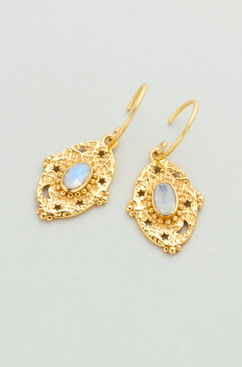 Gold Plated White Moonstone Orion Earrings (style MJU10965GB1) feature oval iridescent stones set in textured, ornate gold frames, displayed on a light background.