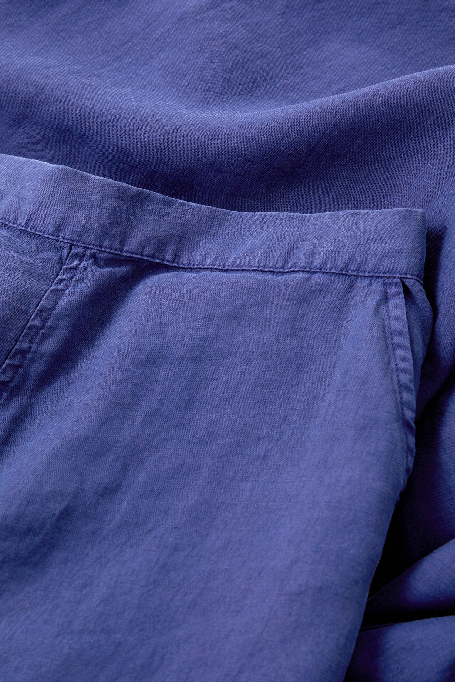 A close up of a pair of Soft Tencel Wide Trouser made from TENCEL LYOCELL fabric with an elasticated waistband.