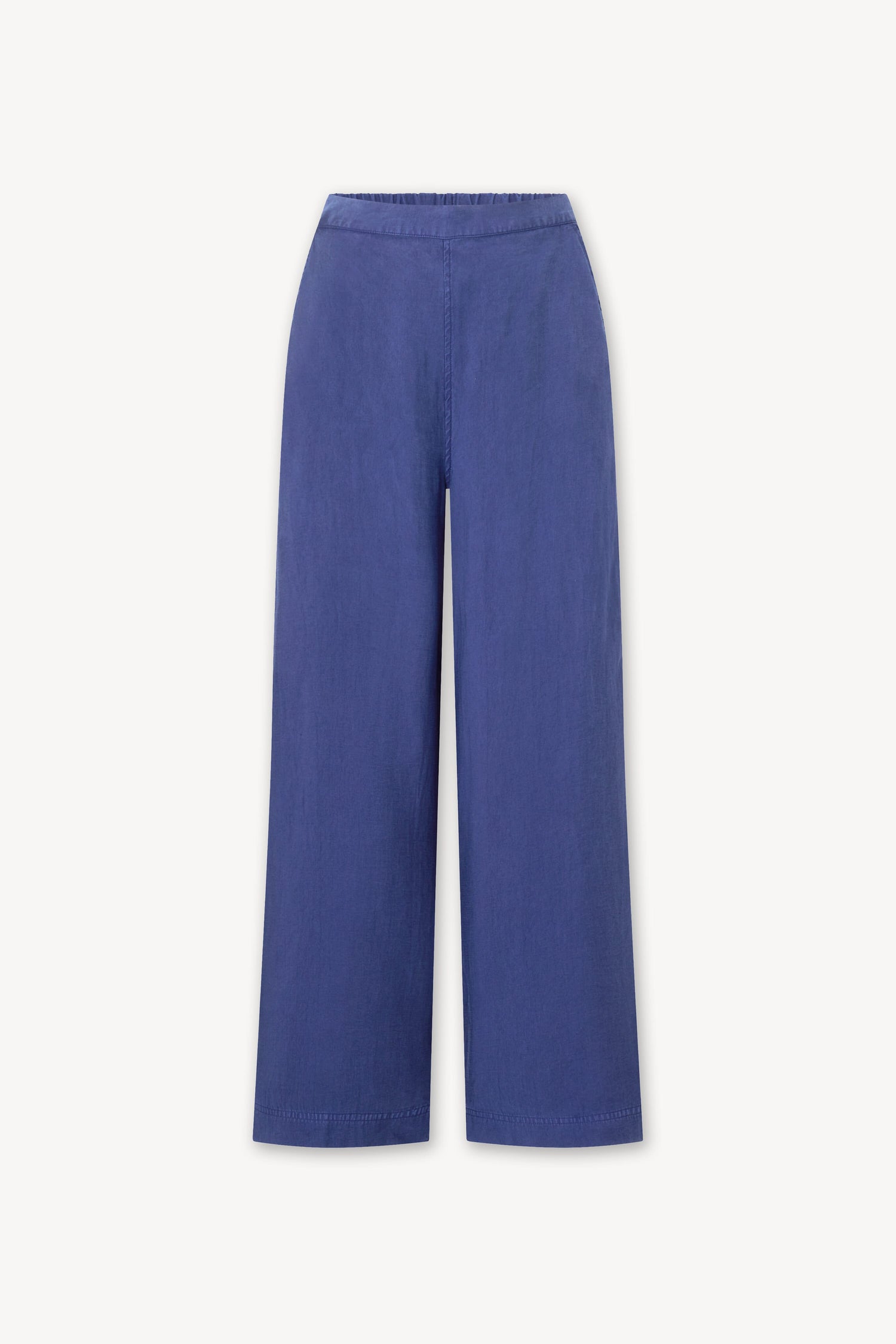 A women's Soft Tencel Wide Trouser in a dark blue color. Made with TENCEL LYOCELL fabric, it features an elasticated waistband for comfort and wide trousers for a stylish fit.