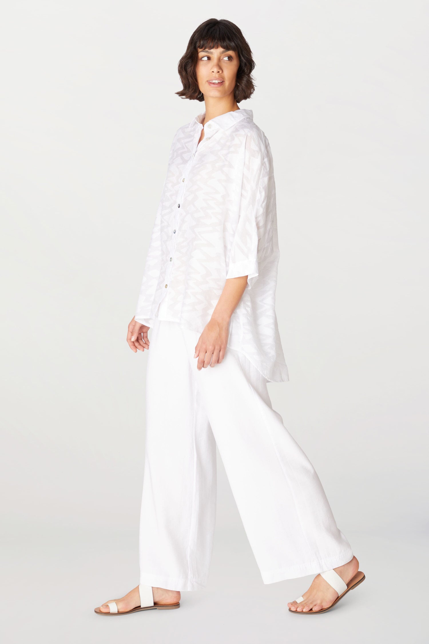 A woman wearing Soft Tencel Wide Trouser made from TENCEL LYOCELL fabric with an elasticated waistband.