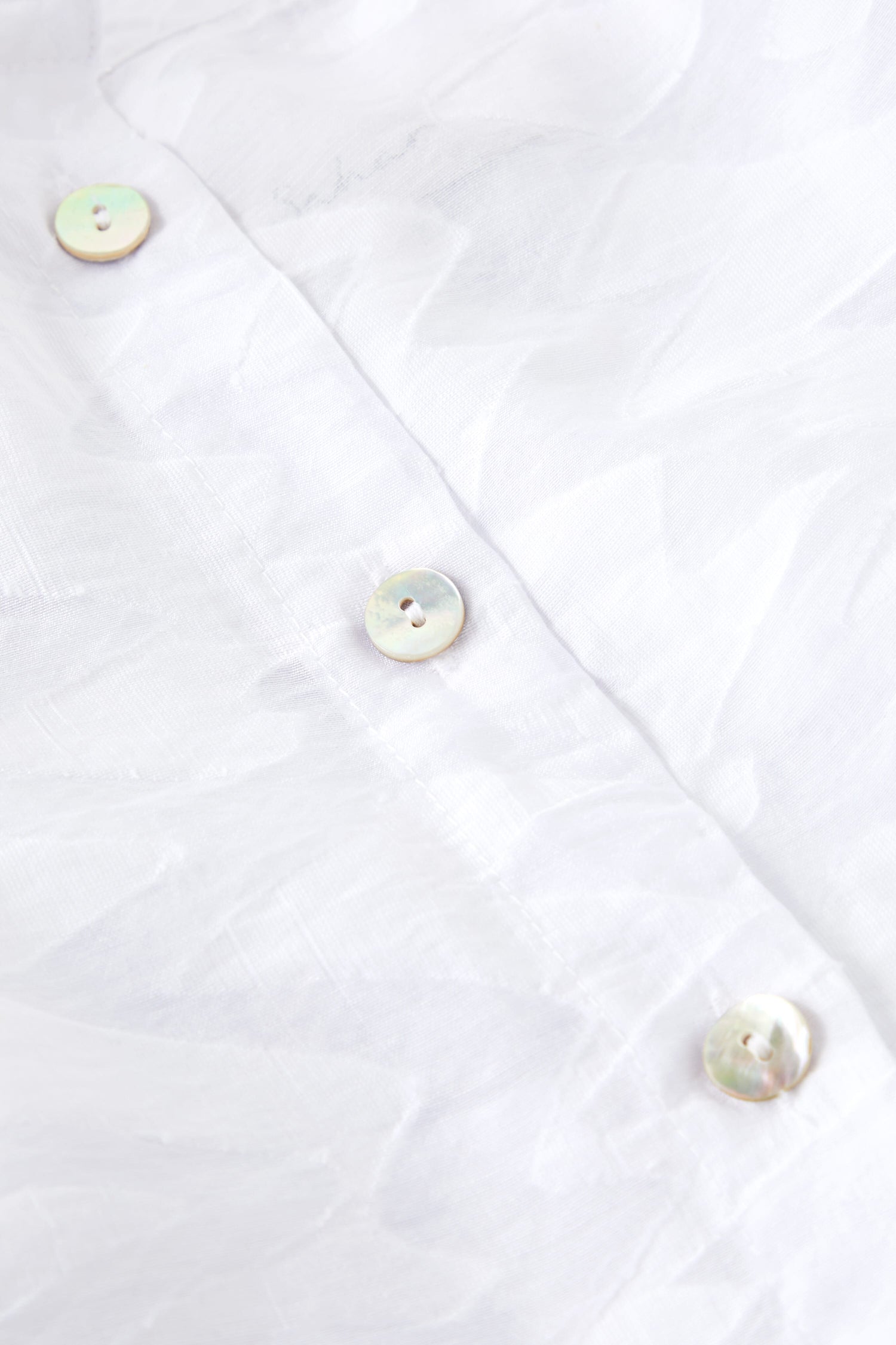 A close-up of the Zig Zag Jacquard buttons on a Zig Zag Jacquard Shirt.