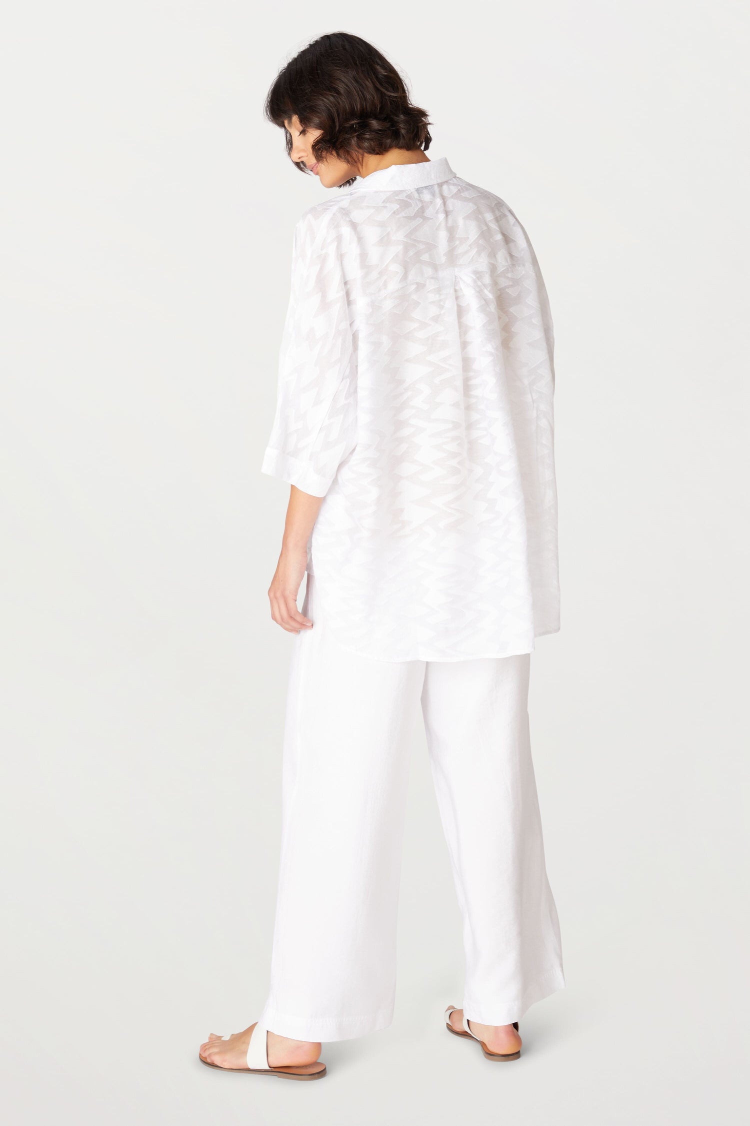 The back view of a woman wearing a Zig Zag Jacquard shirt.