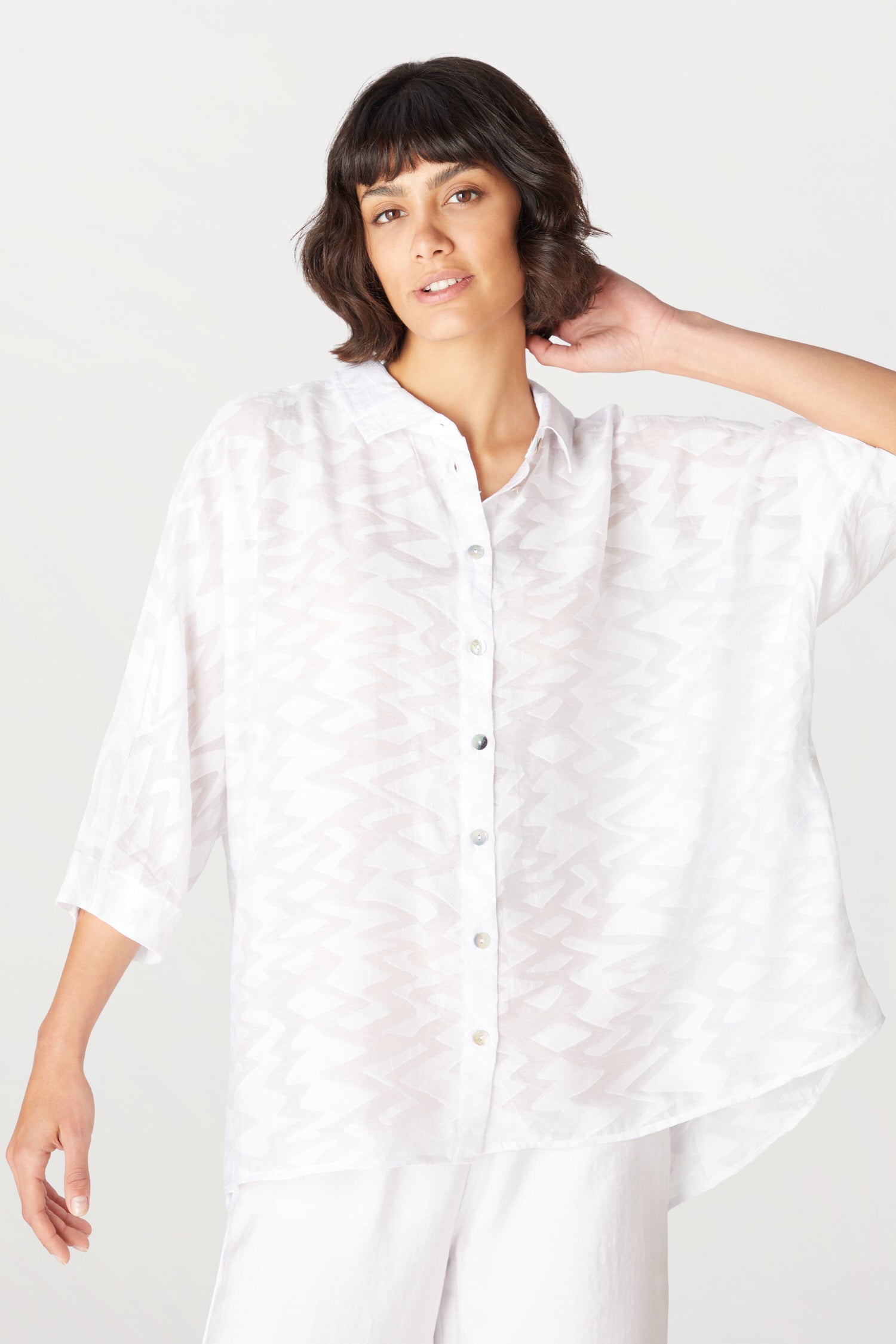 A woman wearing a Zig Zag Jacquard Shirt.