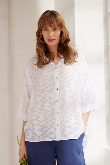 A woman wearing a Zig Zag Jacquard Shirt.