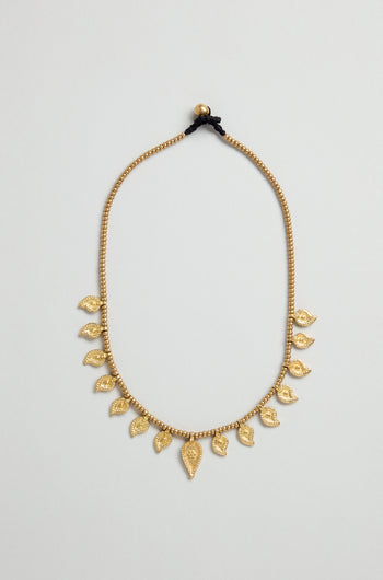 Paisley Necklace featuring gold beading, eleven leaf-shaped charms, traditional Indian metalwork, and a black thread tie closure, showcased on a plain light background.