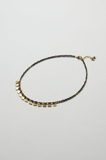 The Short Golden Petal Necklace showcases multicoloured beads and gold-toned round charms with an adjustable clasp, elegantly displayed on a plain white background.