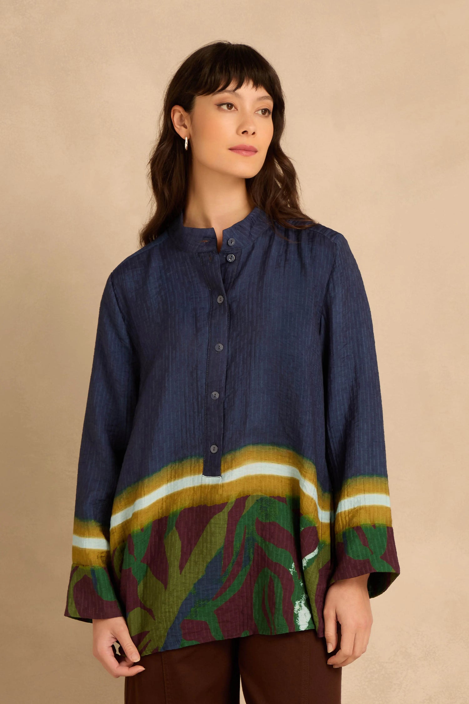 Print Hem Pocket Shirt in dark blue viscose blend with a mandarin collar, long sleeves, and an abstract multi-colored leaf print along the hem.