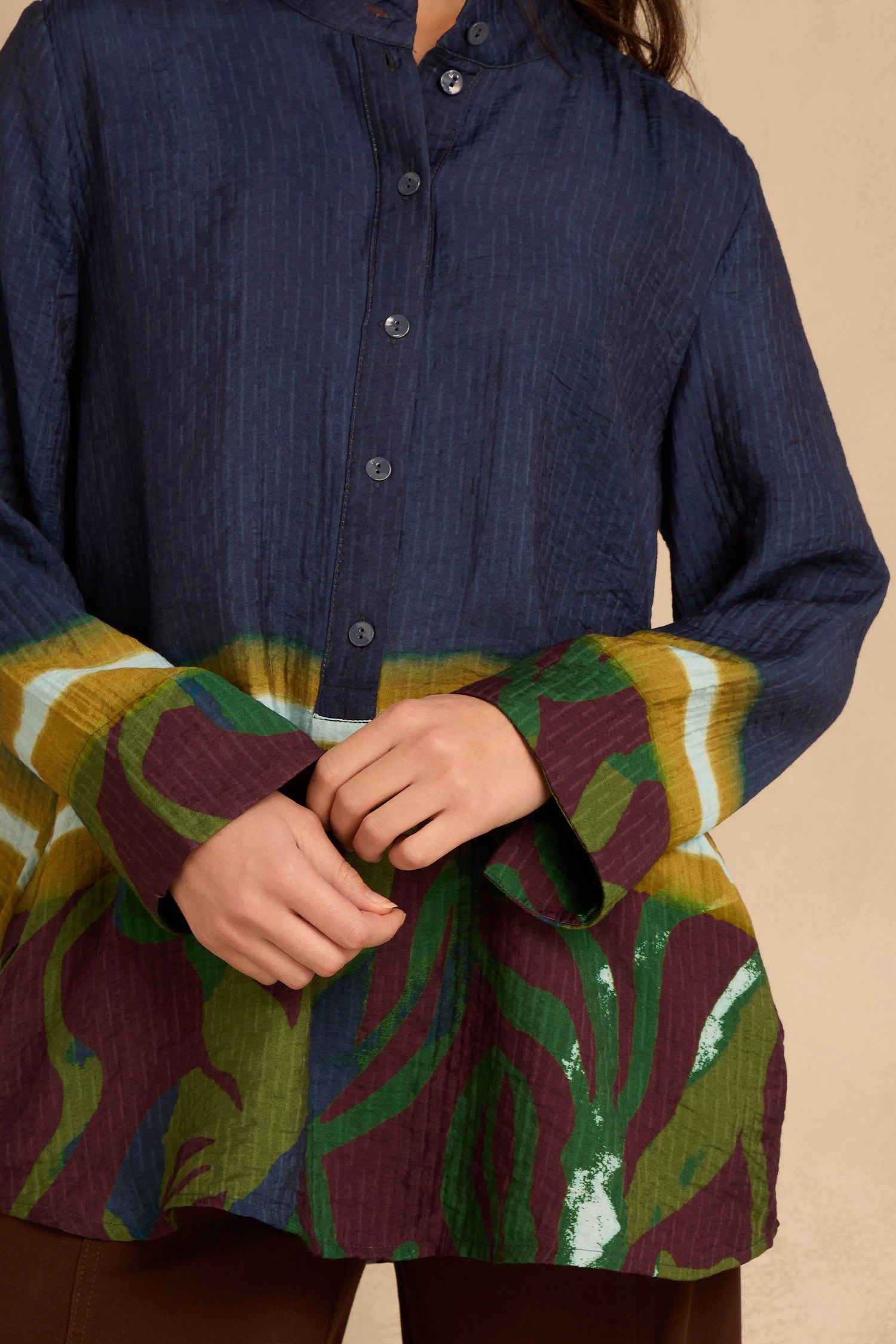 Print Hem Pocket Shirt in a relaxed A-line fit with a dark blue upper section and a multicolored abstract print hem.