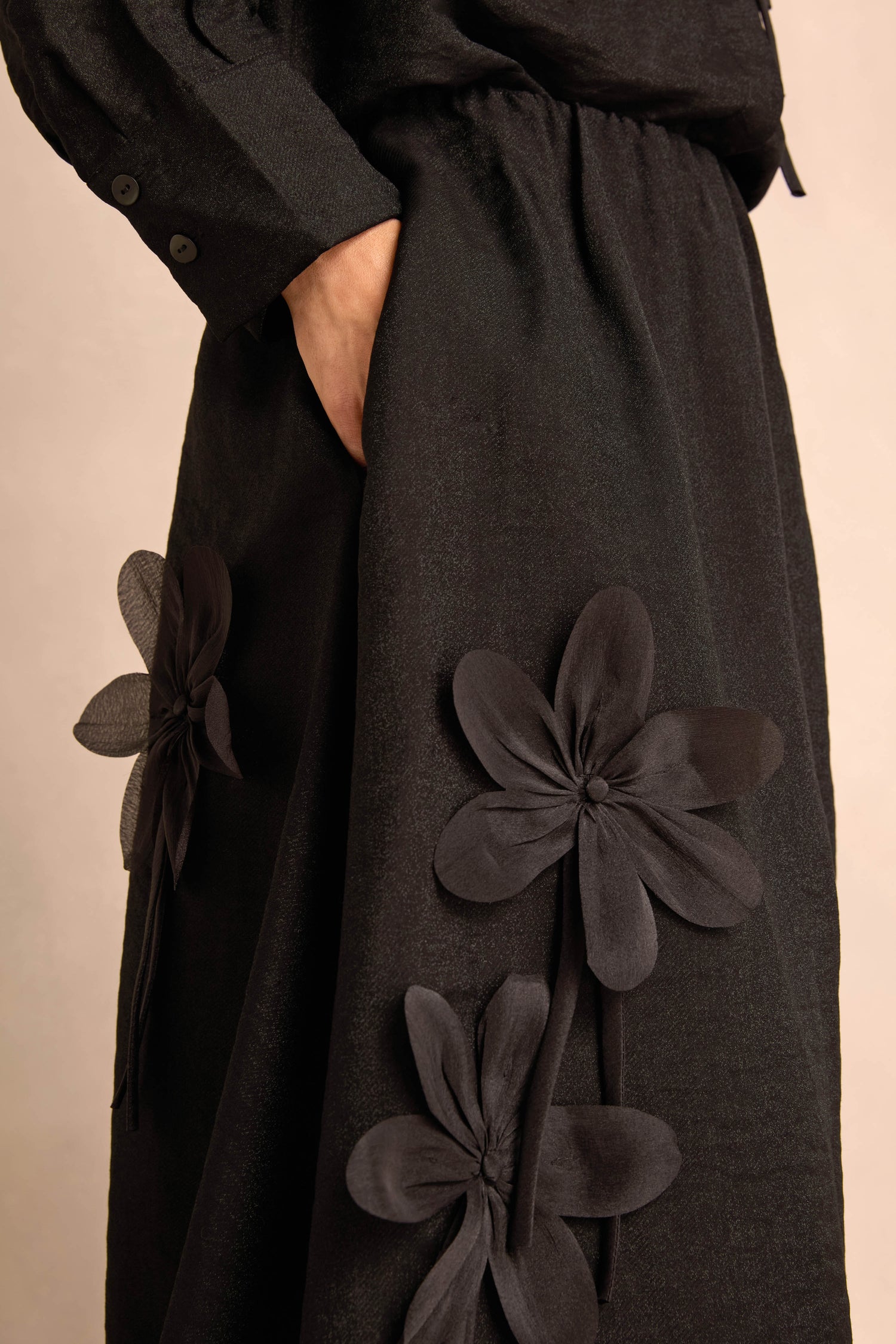 Wearing the Flower Detail Bubble Skirt, a person stands with one hand in their pocket.