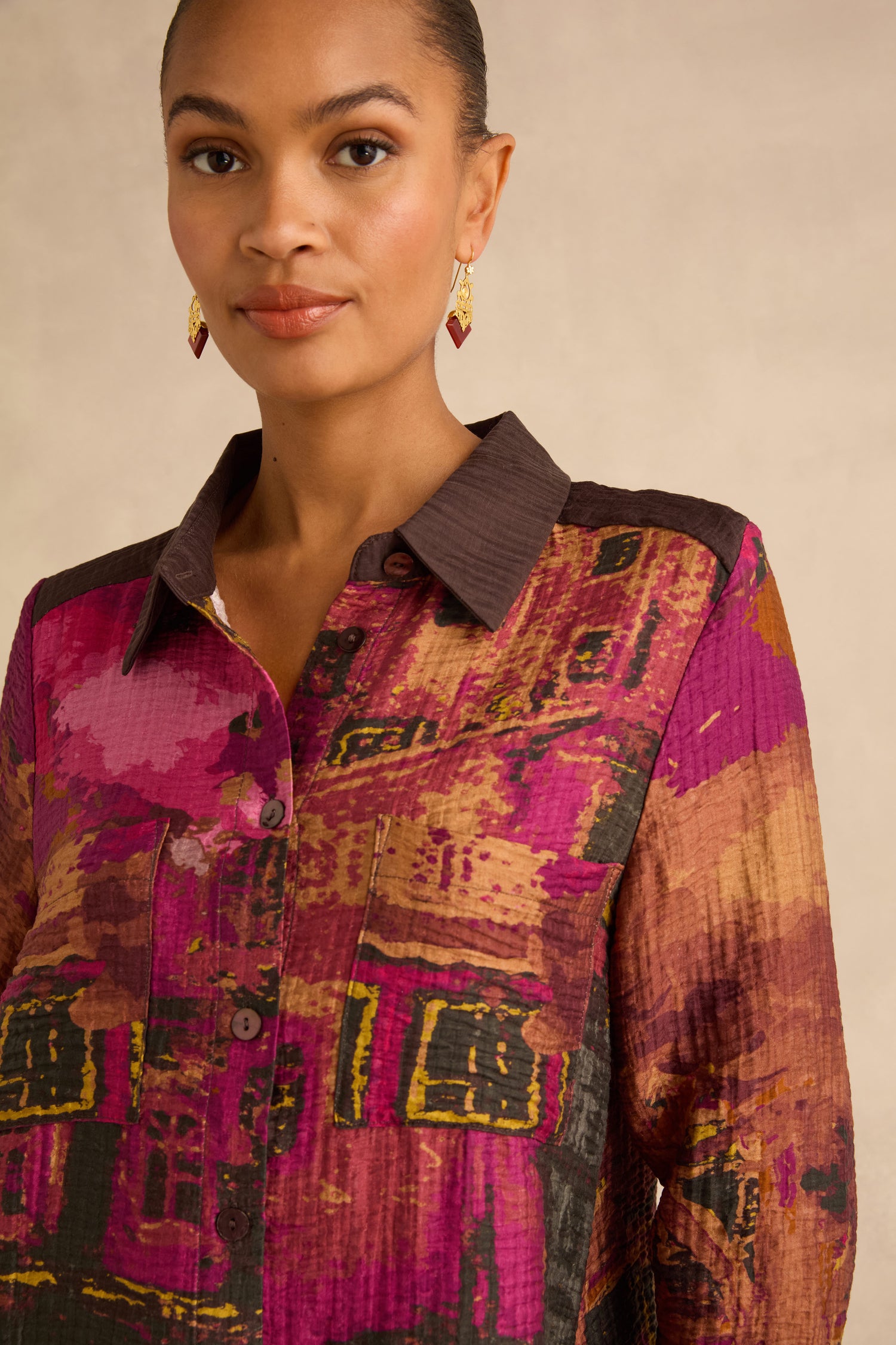 Window Print Pleated Shirt in lightweight viscose, featuring a colorful abstract architectural grid pattern in magenta, brown, and gold with a solid dark brown collar.