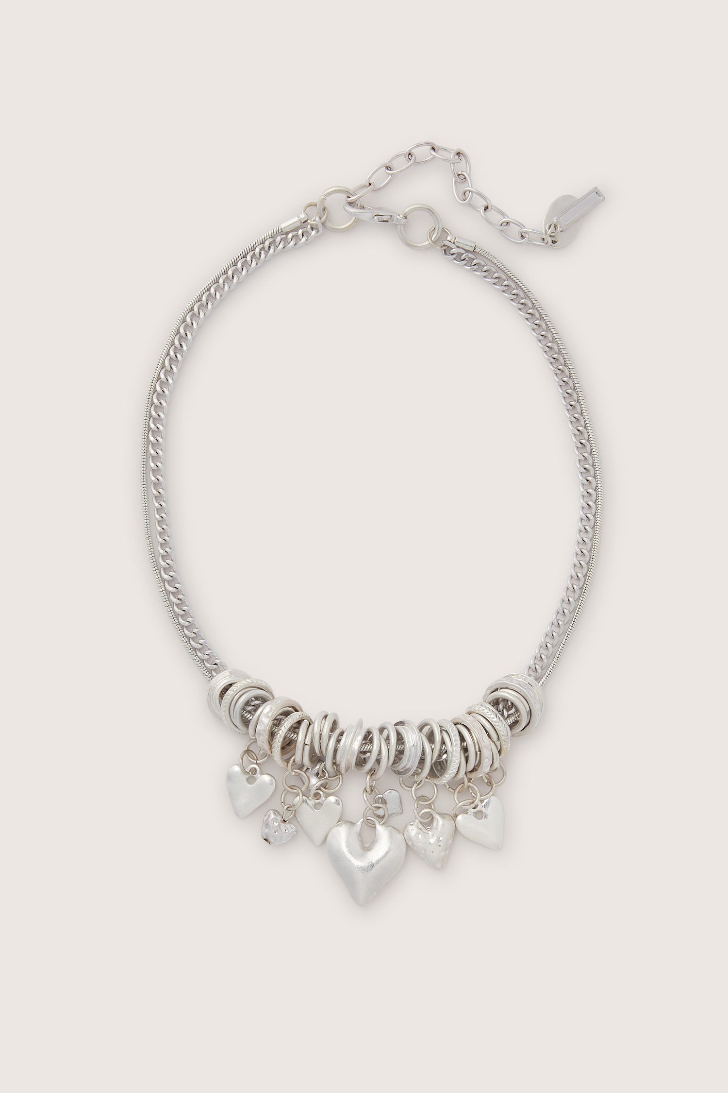 Silver Hearts Charm Necklace with adjustable length on a white background.