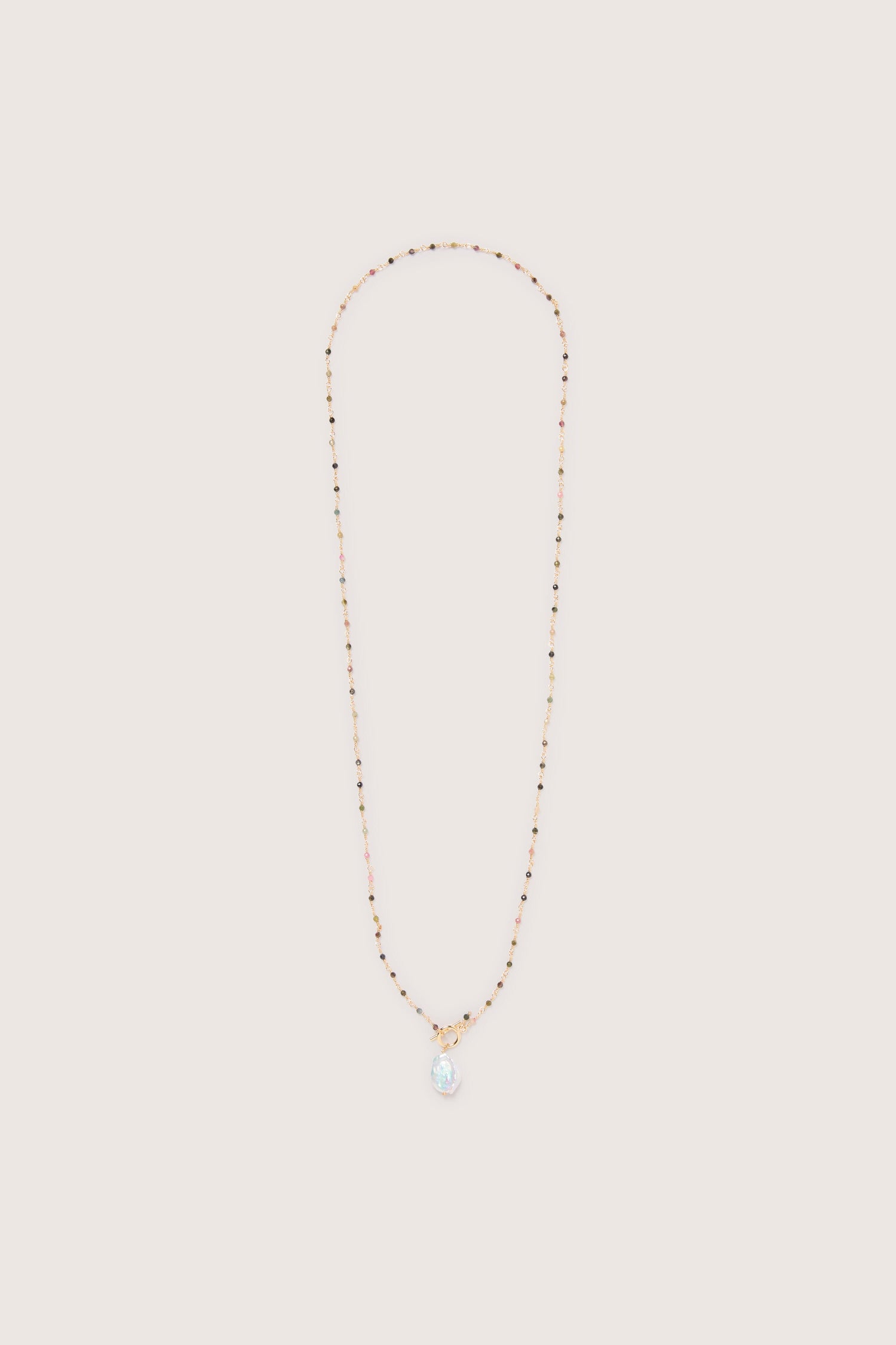 Gold necklace with a Freshwater Pearl Pendant on a white background, adding an elegant touch.