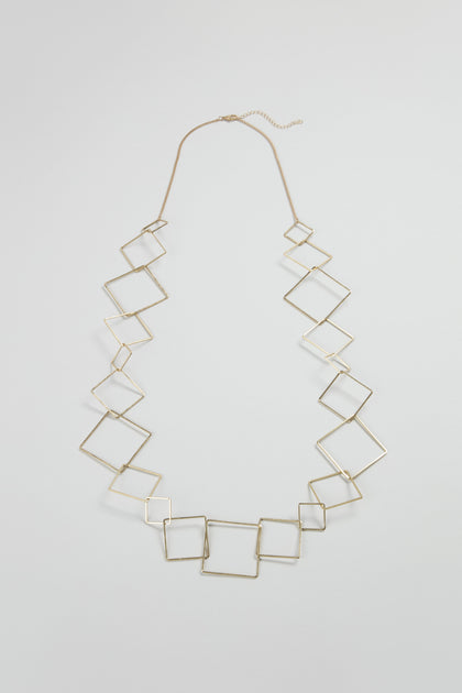 The Gold Long Squares Necklace features interconnected gold-toned open squares on a fine chain, displayed against a plain light background.