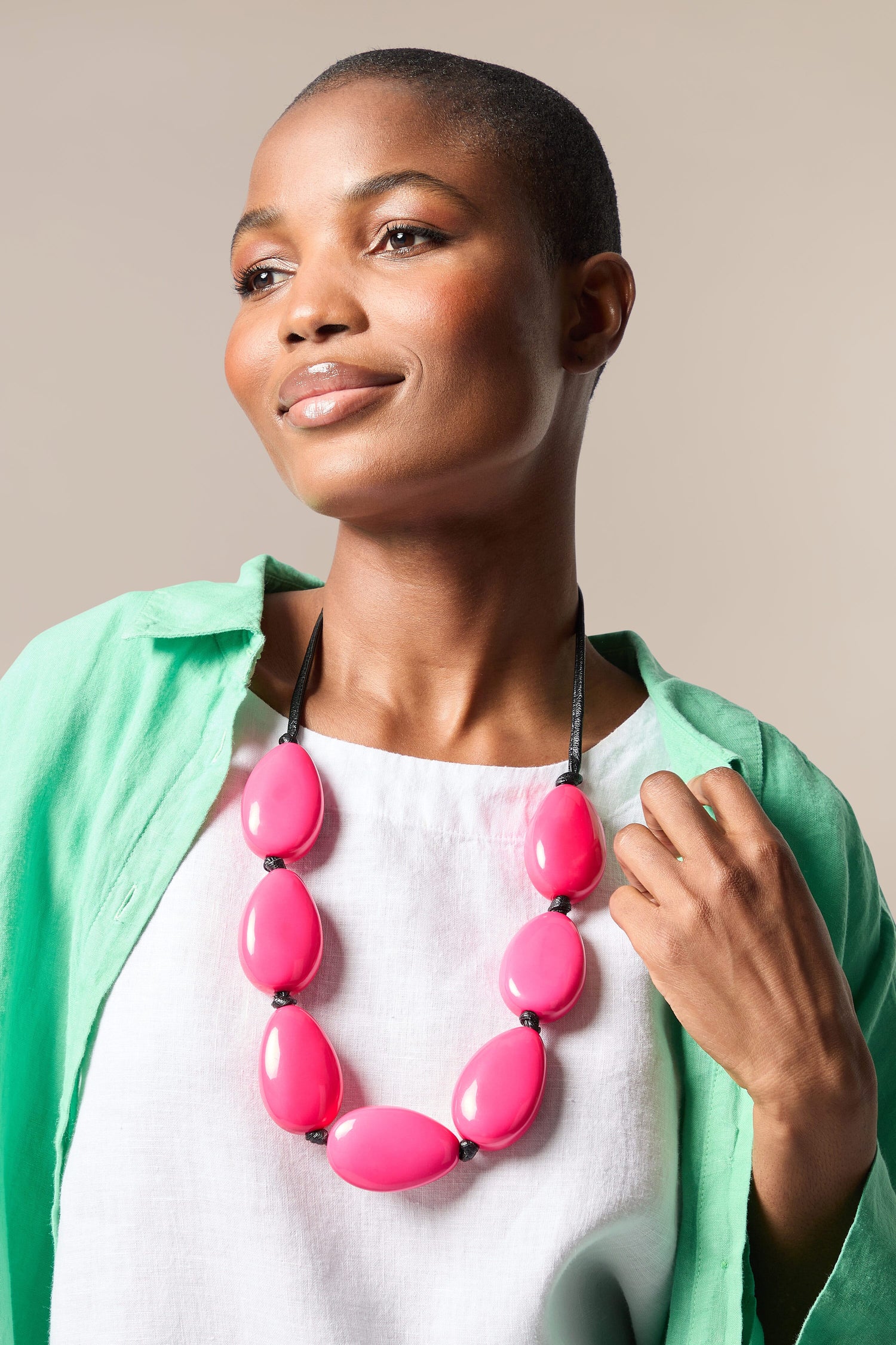 A black woman wearing a Vibrant Bead Necklace.